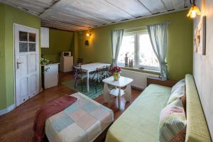 a living room with a couch and a table at Ubytovanie na Šuňave in Vyšná Šuňava