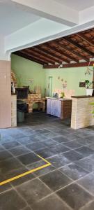 an empty room with a stone floor in a building at Apartamento in Solemar