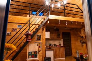 a kitchen with a staircase in a house at Edgar's House in Bnunis