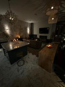 a living room with a bar and a couch at The Balcony Luxury Apartment in Berwick-Upon-Tweed