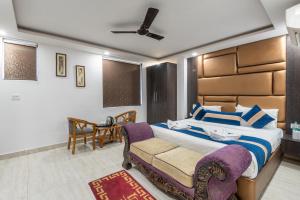 Postel nebo postele na pokoji v ubytování Hotel Royal Inn igi