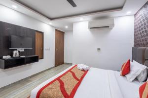 Postel nebo postele na pokoji v ubytování Hotel Royal Inn igi