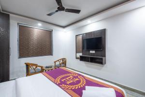 Postel nebo postele na pokoji v ubytování Hotel Royal Inn igi
