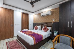 Postel nebo postele na pokoji v ubytování Hotel Royal Inn igi