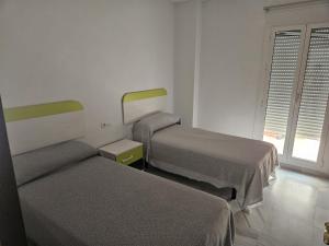 Postel nebo postele na pokoji v ubytování Precioso Apartamento en el centro, Parking Gratis