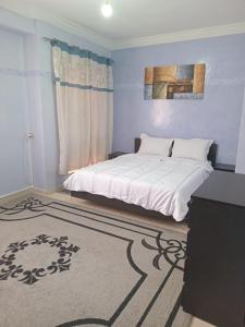 Ένα ή περισσότερα κρεβάτια σε δωμάτιο στο Superbe Appartement 2 chambres à AL FADL Marrakech