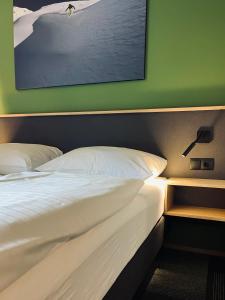 Cama ou camas em um quarto em Hotel Simader