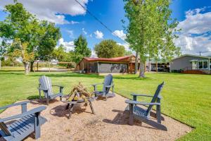 a group of chairs and a table in a yard at Lakefront Graford Home with Fire Pit and Private Dock! in Graford