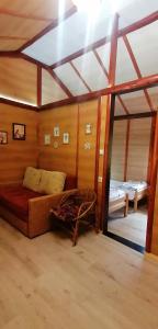 a room with a couch and a bed in it at Kucerak na Drini in Bajina Bašta