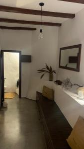 a room with a bed and a mirror on the wall at Casa Moni con Vistas al Mar in Playa de Santiago