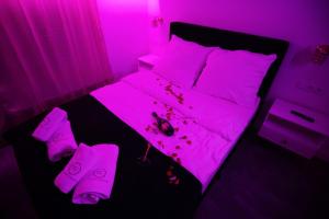 Łóżko lub łóżka w pokoju w obiekcie TS Apartamenty