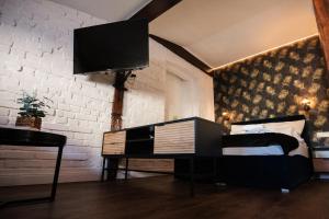 Łóżko lub łóżka w pokoju w obiekcie TS Apartamenty