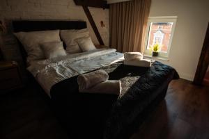 Łóżko lub łóżka w pokoju w obiekcie TS Apartamenty