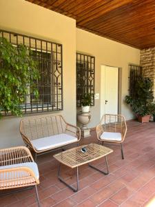 two chairs and a table on a patio at Villa Diana in Montecatini Terme