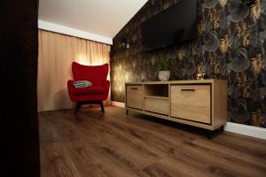 Telewizja i/lub zestaw kina domowego w obiekcie TS Apartamenty