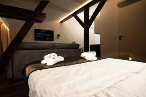 Łóżko lub łóżka w pokoju w obiekcie TS Apartamenty