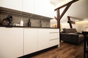 Kuchnia lub aneks kuchenny w obiekcie TS Apartamenty