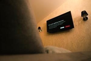 Telewizja i/lub zestaw kina domowego w obiekcie TS Apartamenty