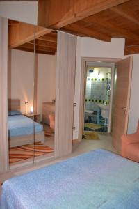 Postel nebo postele na pokoji v ubytování Casa del Tramonto Pistis