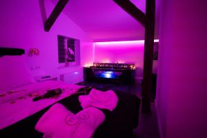 Łóżko lub łóżka w pokoju w obiekcie TS Apartamenty