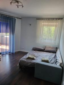 Postel nebo postele na pokoji v ubytování Apartament Domaniówka