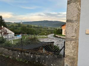 a view of a winding road from a building at proche de la source in Ouhans