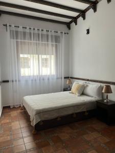 A bed or beds in a room at Dar Al Hurra Még 4 kép