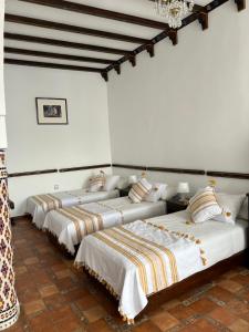 A bed or beds in a room at Dar Al Hurra