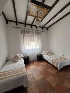 A bed or beds in a room at Dar Al Hurra