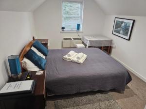 Postel nebo postele na pokoji v ubytování Cosy self-contained flat in Kirriemuir
