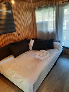 a bed with two towels on it in a room at RedSeaSuite israel in Eilat