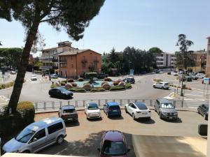 a group of cars parked in a parking lot at Angelana camere in Santa Maria degli Angeli