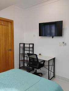 TV a/nebo společenská místnost v ubytování Viva Santo Domingo DN + 6 fotografií