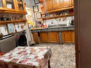 a kitchen with a table with a box on it at Maison wafaa in O Ben Slimane