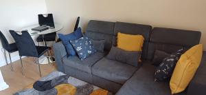 a living room with a couch and a table at The Wheatland House in London