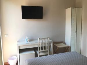 Postel nebo postele na pokoji v ubytování Gialel Pisa Guest House