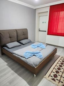 A bed or beds in a room at VATAN SUİT