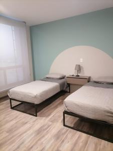 Postel nebo postele na pokoji v ubytování Moderna Residencia