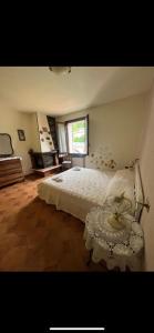 a bedroom with a large bed and a window at PANORAMA,Cremia-casa LUISA in Cremia