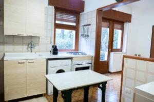 a kitchen with a sink and a dishwasher at I Marchesi dell'Etna in Zafferana Etnea +22 photos