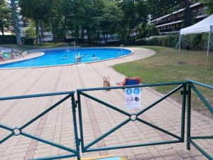a large swimming pool with people in it at Studio rez-de-chaussée in Bougival