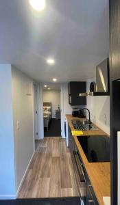a kitchen with a sink and a counter top at Tiny Home in Mosgiel in Mosgiel