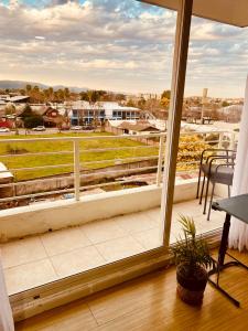 a balcony with a view of a football field at Departamento Central, con estacionamiento gratuito in Talca