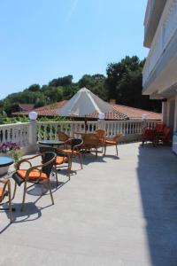 a group of chairs and tables on a patio at Villa Katalina in Varna City
