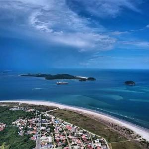 an aerial view of a island in the ocean at Casa na Praia de Canoas in Pontal do Paraná