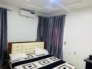 Postel nebo postele na pokoji v ubytování Olatis hotel