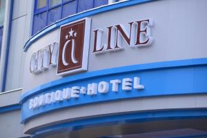 a sign on the side of a building at City Line Boutique Hotel in Tashkent