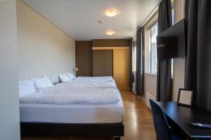 Katil atau katil-katil dalam bilik di Hotel Post