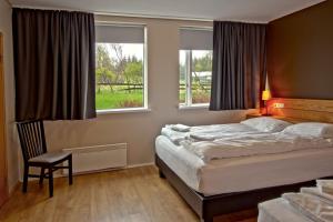 Voodi või voodid majutusasutuse Hotel Post toas