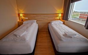 Katil atau katil-katil dalam bilik di Hotel Post